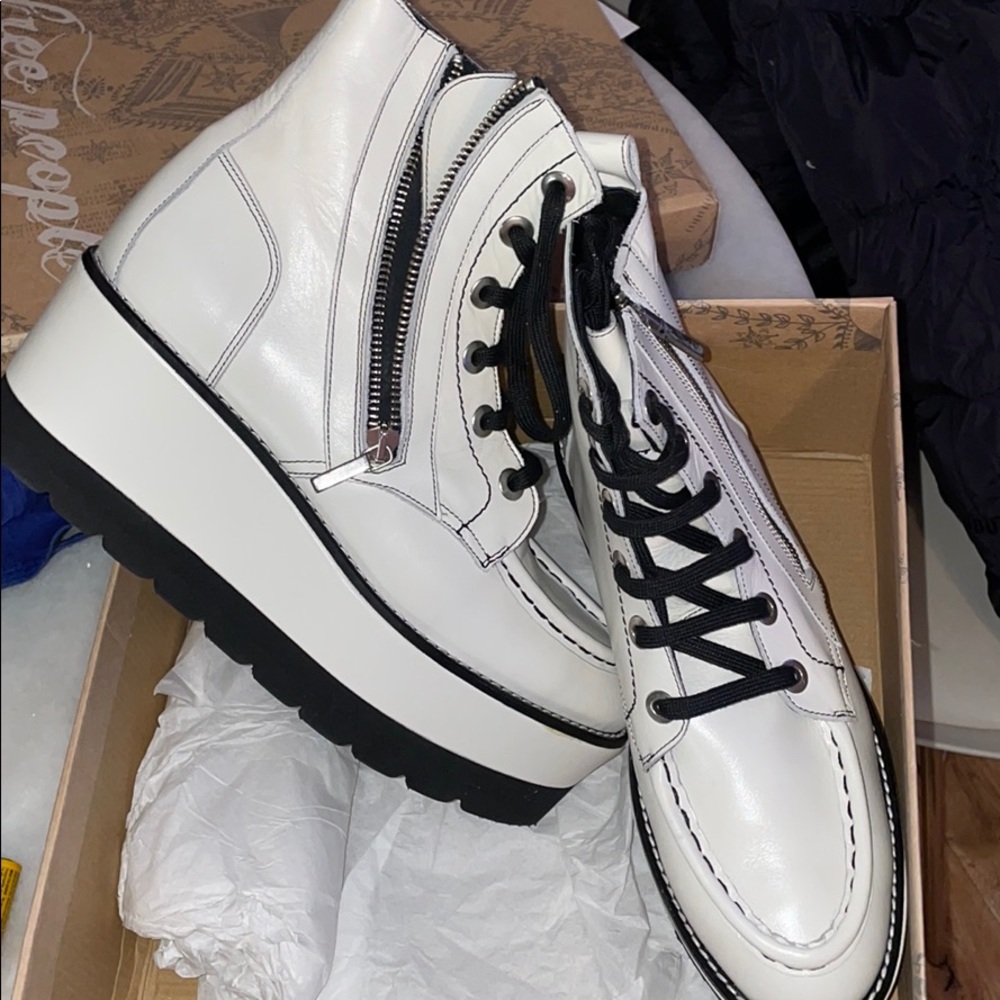 Free People white platform boots.